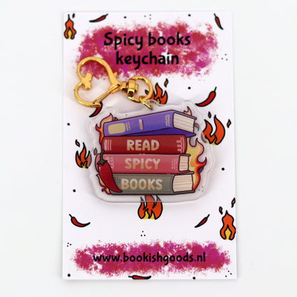 sleutelhanger met een stapel boeken met de tekst I read spicy books